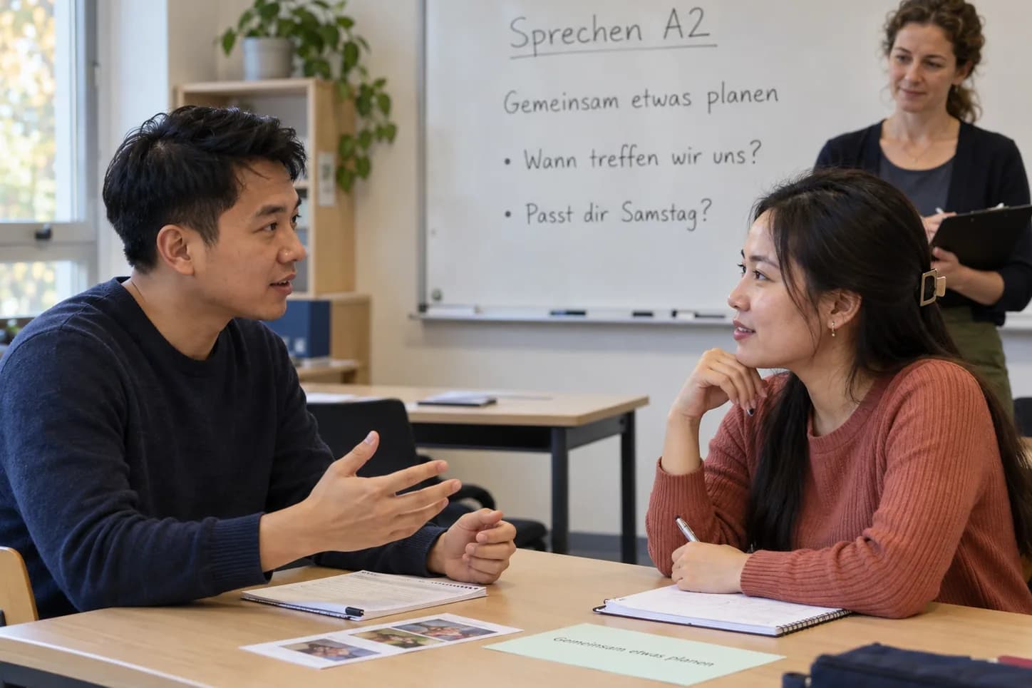 Students practising a paired conversation as in the Sprechen exam